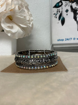 Iridescent Stoneflare Silvertone Bracelet showcasing shimmering iridescent stones and polished silvertone finish, perfect for adding a touch of western style to any outfit.