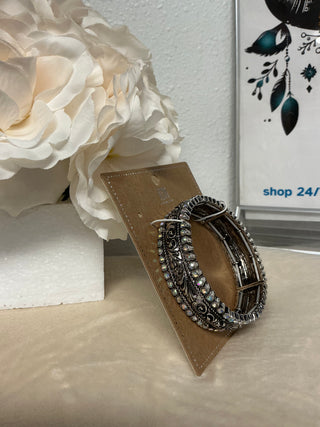 Iridescent Stoneflare Silvertone Bracelet stacked with turquoise and leather bracelets, demonstrating its versatility as a statement piece in western jewelry.