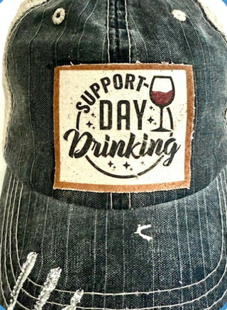SUPPORT DAY DRINKING distressed trucker hat featuring a stylish patch design, perfect for casual outings and summer gatherings.